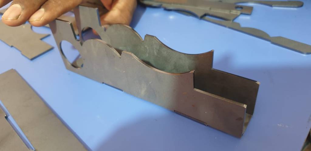 Moved from machined to laser cut parts reduce reduce and cost